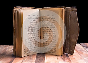 Old holy quran on table