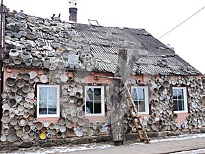 Old home with old pots wall, Lithuania