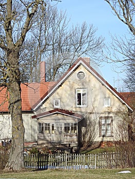 Old home with porch in Rusne town, Lithuania