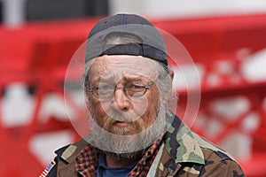 Old Homeless Man Wearing Glasses