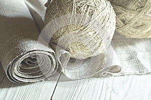 Old homespun linen canvas in roll and yarn in balls