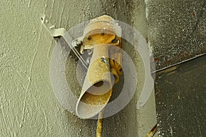 Old hooter on the wall. Old factory hooter. Close-up.