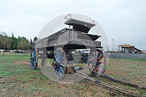 An old horse carriage on the grass