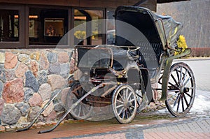 An old horse-drawn carriage. Vintage. Damage. Decorative.