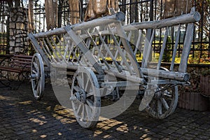 Old horse-drawn cart. In the village yard. Transport