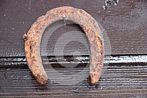 an old horseshoe hanging on a nail, luckily