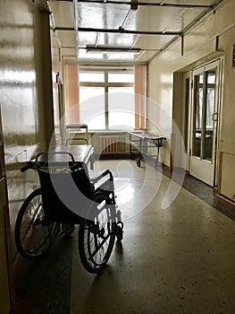 The old hospital from the inside. Disabled wheelchair for transportation of not walking patients