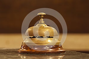 Old hotel bell on a wood stand
