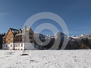 The Old,run-down,derelict,wooden hotel and The Durmitor Mountain at the background photo