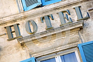 Old hotel sign South of France, provence rustic style, traditional window shutters