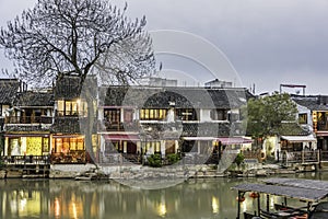 Old house along the river at night