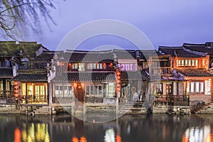 Old house along the river at night