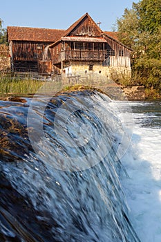 An old house on the cascades of the Dobra River