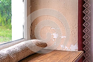 Old house with cracked wall and peeling paint