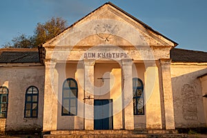 Old house of culture in the light of sunset