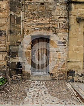 Old House FaÃ§ade with a Wooden Door in Scotland photo