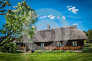 Old house in forest. Open-air ethnography museum in Latvia.