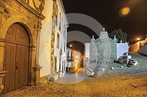 Old house and fountain in baroque style at dusk in Marvao