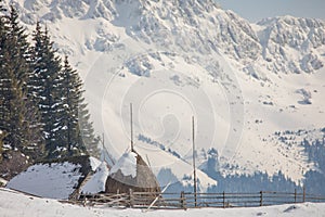 Old house and haystack on a beautiful winter day