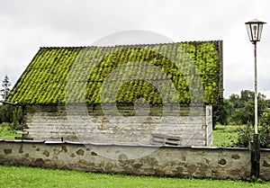 Old house with a moss-covered roof