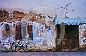 The old house with mural in Tippawan Road, on May 8 in Lampang, Thailand