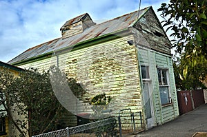 Old house and old shop on a town road in Inglewood a rural northern Victoria Australia.