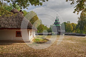 Old house of the peasants and church at the Museum of Pirogovo