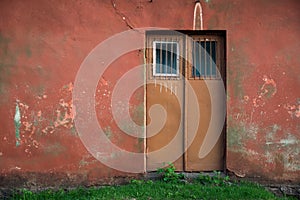 Old house, red wall with grunge old red door, texture