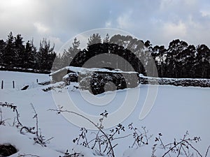 Old house in the snow landscape