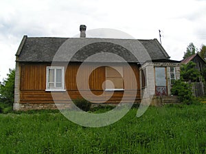 An old house standing in a grassy area.