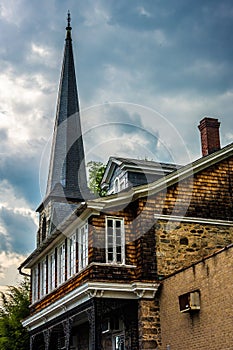 An old house and steeple of a chuch in Ellicott City, Maryland. photo