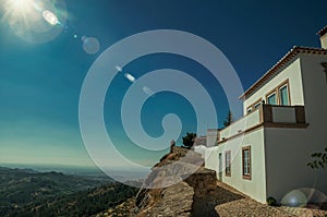 Old house and stone breastwork with mountainous landscape