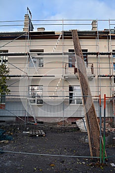 Old house thermal insulation with polystyrene construction and scafolding