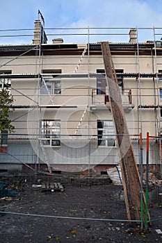 Old house thermal insulation with polystyrene construction and scafolding photo