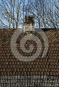 Old house with three kind of roof tiles