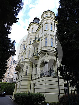 Old house, trees on the street in Karlovy Vary, Czech Republic