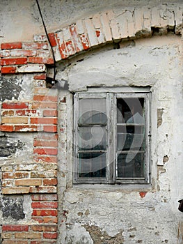 Old house wall with wooden window