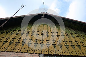 Old house with wooden carved wall ornaments