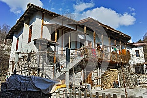 Old house with wooden porch in village of Rozhen, Bulgaria