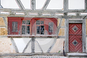 Old housefront with bulls-eye windows