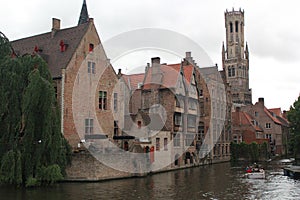 Old houses with the Beffroi tower in the background in Bruges