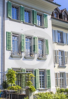 Old houses in Bern. Houses with flowers on the windows. Architecture