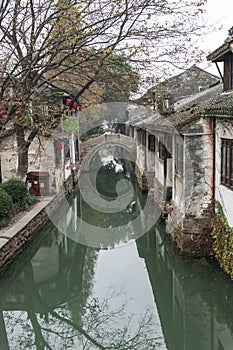 Old houses and bridge reflection