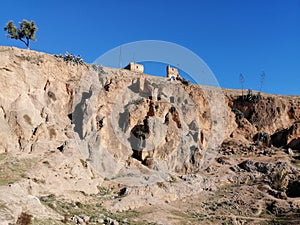 Old houses carved amid the mountains in the city Fez Morocco