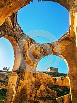 Old houses carved amid the mountains in the city Fez Morocco photo