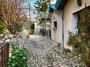 Old houses and cobblestone street in picturesque village Laneia