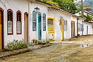 Old houses in colonial architecture and cobblestone streets