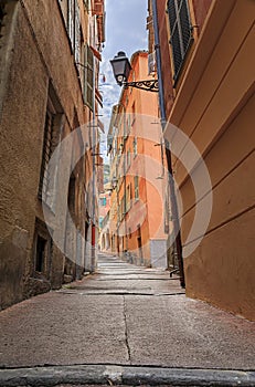 Old houses on a crooked street in Old Town Vieille Ville, Nice, South of France