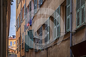 Old houses on a crooked street in Old Town Vieille Ville, Nice, South of France