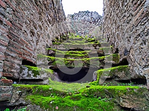 Old stone staircase in the city of pompeii photo